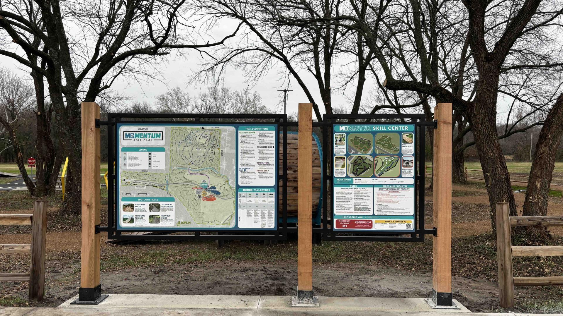 Central hub with signage for park map and rules