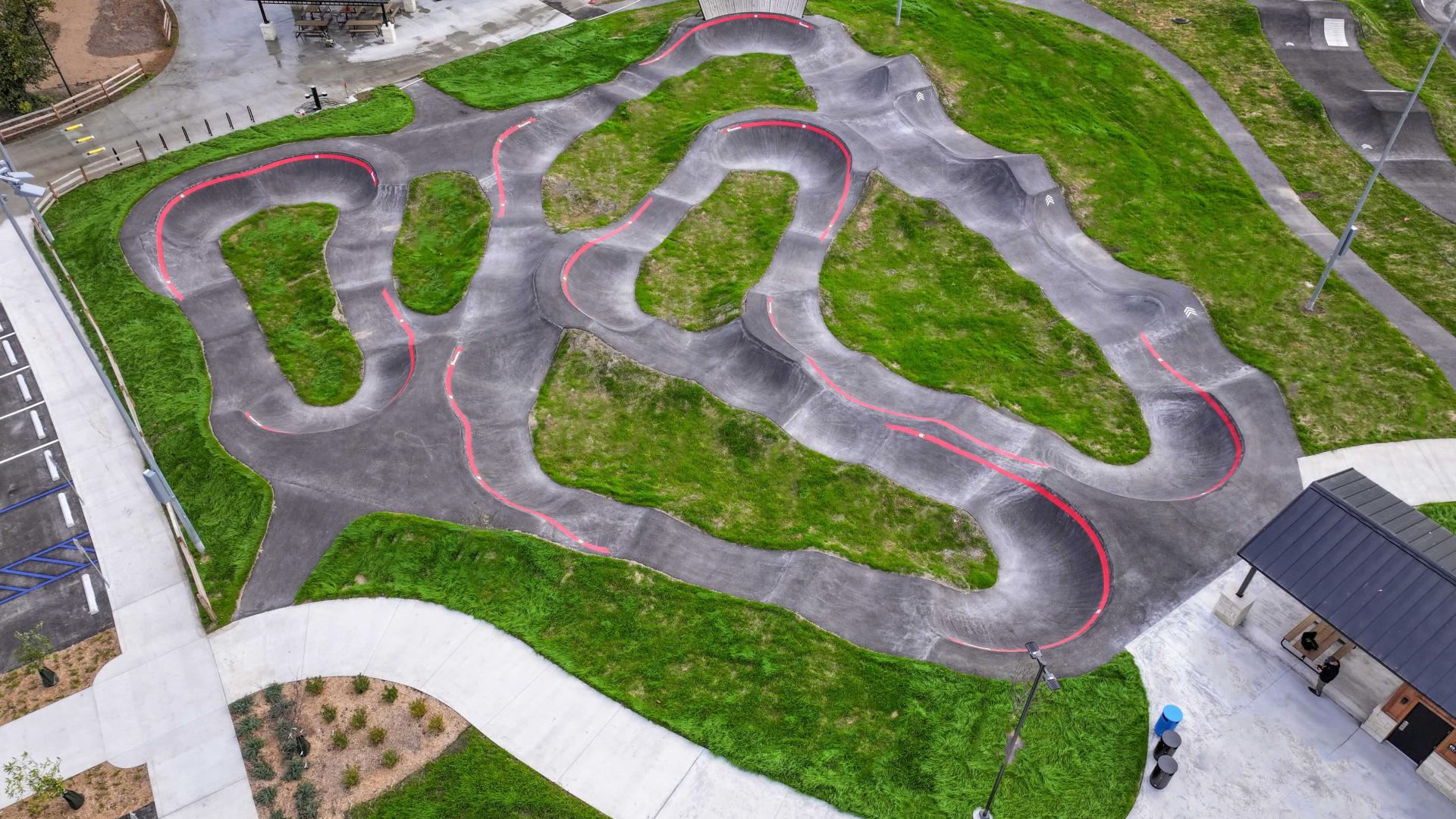 Aerial drone image looking down on the Pump Track empty daylight
