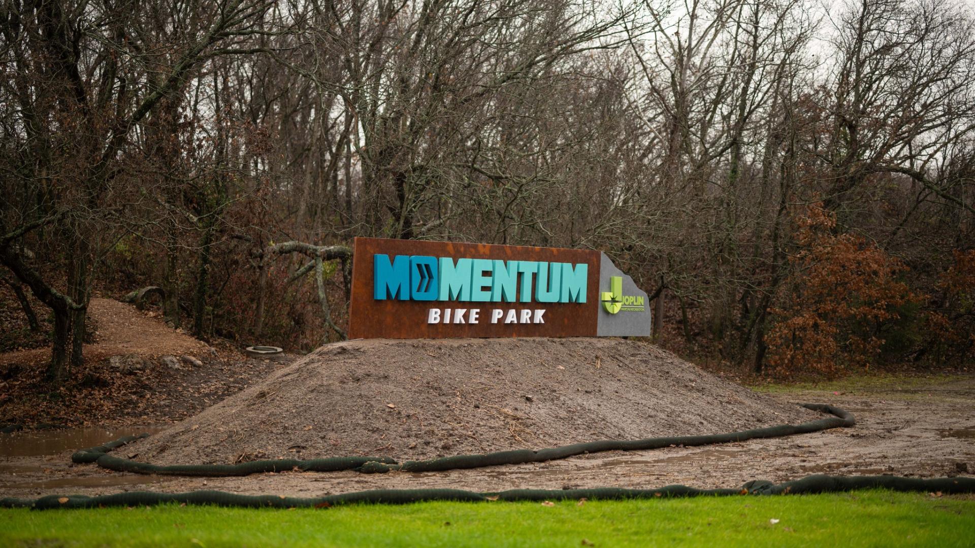 MOmentum Bike Park main entry landmark sign at Lone Elm
