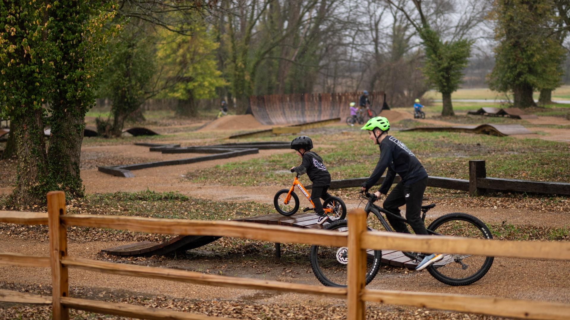 Riders on skills course near post fencing