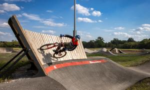Pump track rider on banked curve